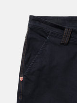 Blue de Gênes BGpaulo Pavia V3 Chino - Midnight Blue trousers in an enzyme-washed dark blue, featuring brown contrast stitching and a small red and white shield emblem near the side pocket.