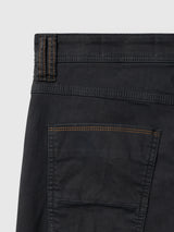 Close-up of the back of the enzyme-washed black BGpaulo Pavia V3 Chino, featuring a patch pocket and brown contrast stitching.