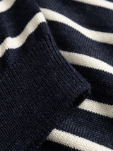 Close-up of a Blue de Gênes BGdaw Stripe Knit - Navy, a 100% wool crewneck sweater featuring horizontal navy blue and white stripes and a ribbed cuff.