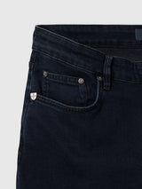 BGvinci Black OD V3 Jeans in dark blue with a comfortable regular fit, featuring a coin pocket with a small shield-shaped logo emblem and metallic rivets.
