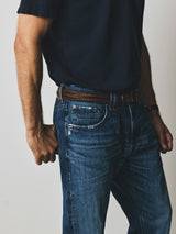A person wearing relaxed fit BGmarco Sioux Jeans - Used with a brown braided leather belt and a navy polo shirt.
