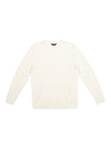 The Blue de Gênes Monte Knit - Whitecap is a cream-colored long-sleeve shirt made from a comfy cotton/linen blend, showcased on a plain white background. It features a round neck and roll-rib hem, reflecting minimalist design.