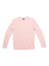 A Monte Knit - Porcelain Pink jumper from Blue de Gênes rests on a white backdrop. This long-sleeve crewneck is crafted from a cotton/linen blend, offering a soft, lightweight feel. Its minimalist design includes a subtle roll-rib hem for texture.