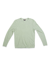 The Monte Knit - Green Bay by Blue de Gênes is a light green long-sleeve crew neck shirt, shown on a white background. Made from a soft cotton/linen blend, it features a subtle texture with the shirt laid flat and arms extended.