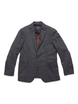 The Leopardi Dori Blazer by Blue de Gênes features a gray pinstripe design in an Italian cotton-wool blend, with two buttons, a notched lapel, four-button cuffs, and red interior piping. Expertly tailored in Portugal, it is ideal for professional or semi-formal settings.