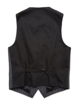 The image highlights the back of the Canna Dori Gilet - Grey Stripe by Blue de Gênes, made with an Italian cotton-wool blend. It showcases a black vest with a dark gray stripe pattern, an adjustable buckle strap, and a pointed finish, all reflecting fine Portuguese tailoring.