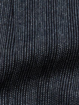 The Canna Dori Gilet - Grey Stripe by Blue de Gênes features a close-up of dark fabric with fine white pinstripes, made from an Italian cotton-wool blend. Its soft, slightly rippled texture highlights the exquisite touch typical of Portuguese tailoring, with evenly spaced vertical stripes.