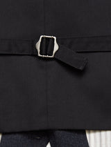 Close-up of a fabric belt with a metal buckle on a dark garment, highlighting the exquisite Portuguese tailoring of Blue de Gênes Canna Santo Gilet - Navy, with Italian wool blend striped fabric partially visible at the bottom.