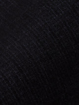 Close-up of navy Menzo Alvaro Chino fabric by Blue de Gênes, featuring fine vertical ribbed patterns. The textured material offers comfort stretch and a smooth, slightly shiny appearance for a subtle play of light.