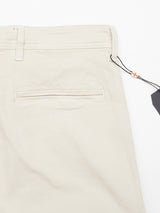 The Menzo Dobby Chino - Stone by Blue de Gênes showcases a back view with a single welt pocket, black tag, colorful charm, smooth vintage-look fabric, belt loops, and comfort stretch for easy movement.