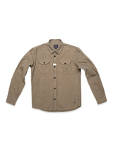 The Ginotto Oregon Shirt - Pebble Beige by Blue de Gênes is a brushed cotton button-up with long sleeves, a collar, black buttons, two front chest pockets with buttons, and a small rectangular tag above the left pocket.
