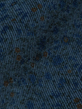 The dark blue baby corduroy fabric of the Enrico Cord Shirt by Blue de Gênes features a ribbed texture with subtle brown spots, giving it a rich, tactile appearance.