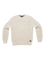 The Adamo Knit - Pebble Beige by Blue de Gênes is a soft lambswool crewneck sweater with a mélange speckled pattern, featuring long sleeves, ribbed cuffs and hem, shown on a white backdrop.