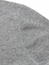 Close-up of the textured Monte AW Knit - Stormy Grey from Blue de Gênes, featuring a luxurious and cozy Merino wool fabric. The visible stitching and smooth finish highlight its soft appearance.