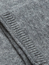 Close-up of folded Monte AW Knit - Stormy Grey by Blue de Gênes, revealing its soft merino wool texture and subtle ribbed pattern along the edge, evocative of a crewneck jumper.