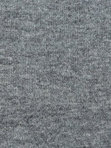 Close-up of the Monte AW Knit - Stormy Grey by Blue de Gênes, highlighting its intricately textured fabric that resembles Merino wool with a soft, uniform weave pattern and subtle shade variations.