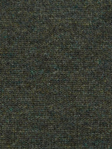 The Monte AW Knit - Forest by Blue de Gênes features a close-up of dark green Merino wool with a mottled black and teal pattern. Its soft, densely woven slubby yarn showcases visible knit stitches, creating a cozy texture perfect for a crewneck jumper.