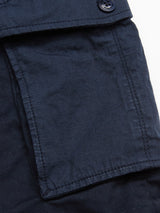 The Paulino Cargo Shorts - Navy by Blue de Gênes features a textured square utility pocket with a flap and button closure. Made from durable, military-inspired cotton, the shorts highlight visible edge stitching.