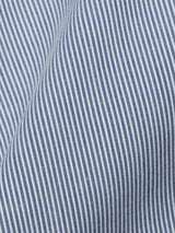 The Elak Riga Shorts in Blue Stripe by Blue de Gênes feature a close-up of blue and white pinstripe fabric, revealing a slightly curved and wrinkled texture. Thin vertical blue stripes on a white background offer a classic and elegant look.