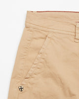 Close-up of Blue de Gênes Menzino Shorts in khaki with a herringbone fabric finish; features include a pocket with shield-design button, visible stitching, and a waistband with belt loops.