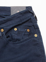 Close-up of Repi Grasso Jeans - Navy by Blue de Gênes, showcasing regular slim-fit with visible front pocket, metal rivets, and a hint of the label on the waistband. The design includes textured fabric and classic five-pocket styling.