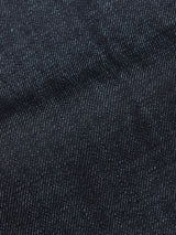 Close-up of Blue de Gênes Giacomo Selvedge V2 Jeans in raw denim, highlighting dark blue fabric with white stitching and a slightly wrinkled finish—hallmarks of quality Italian-made rigid jeans.