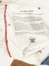 Close-up of the Giacomo Bull WTH - White Denim by Blue de Gênes, showcasing Italian craftsmanship with stone-washed heritage. Text highlights construction details, featuring red stitching and buttons that add character. Made in Italy excellence is evident in every detail.