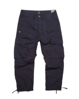 The Mustang Cargo Pant - Navy by Blue de Gênes is made from parachute cotton, featuring utility pockets, an adjustable drawstring waist, and drawstrings at the ankles.