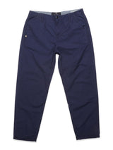 The Lori Tarlo Chino in navy from Blue de Gênes is displayed on a white background. These relaxed-fit pants are made of navy cotton and include features like a button and zipper closure, belt loops, and side pockets.