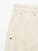 The Palto Desk Chino - Natural by Blue de Gênes is showcased up close, highlighting a side pocket and logo near the seam. The cotton/linen blend has a subtle texture with belt loops on the waistband, all in a relaxed fit against a white backdrop.