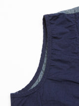 Close-up of the Ludovico Tarlo Gilet - Navy by Blue de Gênes, a sleeveless chambray garment highlighting visible stitching, texture, and hem detail against a white background.
