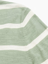 Close-up of the Monte Stripe Knit - Green Bay by Blue de Gênes, featuring horizontal green and white stripes in a cotton/linen blend. Focus on the sleeve of this classic crewneck jumper, showing knitted texture and visible stitching.