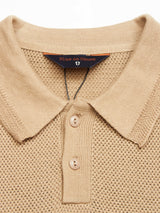 The Filo Knit Polo in khaki has a retro stitch texture, smooth collar, and three-button placket. Made from 100% cotton for comfort, it features a Blue de Gênes label inside the collar.