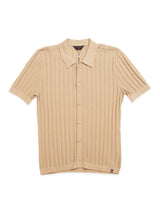 The Compra Open Polo Knit by Blue de Gênes is a khaki short-sleeve polo shirt with a collared neckline and button-up front. Made from organic cotton, it showcases a textured cable pattern throughout.