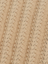 A close-up of Blue de Gênes Compra Open Polo Knit in khaki, made of organic cotton, showcases a chevron pattern with small eyelets for a textured, decorative look.