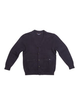 The Achille Cardigan - Navy by Blue de Gênes is a dark navy cotton cardigan featuring a V-neck, corozo buttons, and two front pockets. Its fabric displays subtle vertical ribbing, reflecting advanced knitting techniques for enhanced texture.