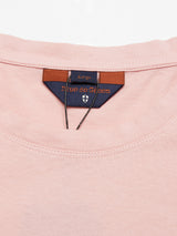 The Salty Logo T-Shirt in Porcelain Pink from Blue de Gênes is a Large cotton-jersey crewneck featuring subtle chest embroidery and a brown leather patch.