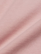 Close-up of the Salty Logo T-Shirt by Blue de Gênes in Porcelain Pink, made from cotton-jersey fabric with a soft texture and subtle diagonal wave pattern for a smooth, delicate appearance.