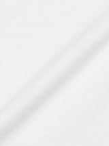 Close-up of the BdG S/S Grandad - Snow White by Blue de Gênes, featuring white fabric with a subtle diagonal crease. Made from cotton slub yarn, it has a soft yet slightly coarse texture, giving it a natural woven look reminiscent of a classic Grandad t-shirt.