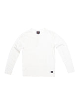 The BdG Grandad - Snow White by Blue de Gênes features a classic white long-sleeve design crafted from cotton slub yarn, a round neckline, and a short button placket with Corozo nut buttons, elegantly displayed on a white background.