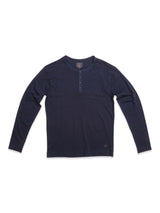 The BdG Grandad - Navy by Blue de Gênes is a long-sleeve T-shirt with a buttoned placket using Corozo nut buttons and features a stitched logo near the hem.