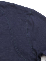 Close-up of BdG Grandad - Navy fabric by Blue de Gênes, showcasing intricate stitching and cotton slub yarn texture against a plain white background.