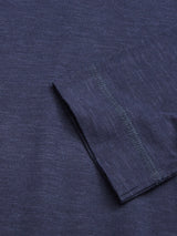 Close-up of BdG Grandad - Navy by Blue de Gênes: a dark blue fabric with a subtle heather texture. It features folded seam details and expertly stitched edging, showcasing the craftsmanship. The cotton slub yarn weave enhances its natural beauty.