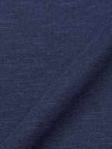 Close-up of BdG Grandad - Navy fabric by Blue de Gênes, folded to reveal a subtle textured pattern. Crafted from cotton slub yarn, it appears soft and heathered with classic blue tones.