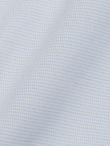 The Basso Dob Shirt - Blue Water by Blue de Gênes showcases a white cotton jacquard fabric with a subtle grid pattern and small blue dots in a yarn dye stripe design, evoking the elegance of European tailoring with textured waves.