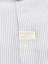 Close-up of the Blue de Gênes Basso MC Shirt - Navy Stripe, a regular fit shirt with thin black yarn dye stripes and cream buttons made from real natural Corozo nut.