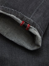Close-up of the cuff on Vinci G Dark Grey Jeans by Blue de GĂȘnes, featuring a neatly folded hem with visible white selvage edge and two red stitch accents in premium comfort stretch grey denim.