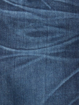 Close-up view of Vinci Used Jeans - Used by Blue de Gênes, showcasing blue comfort stretch denim with visible texture, stitching, and natural creases highlighting light and dark patterns on the fabric.