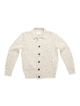 The Blue de Gênes Sakura Knit Cardigan in Stone is a cream chunky knit sweater with long sleeves, front pockets, and large dark buttons, pictured laid flat on a white background.