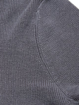 Close-up of the Porto Knit - Dark Slate by Blue de Gênes, showing textured 100% wool fabric with visible stitching, waffle-knit pattern, and curved edge—ideal for classic menswear style.